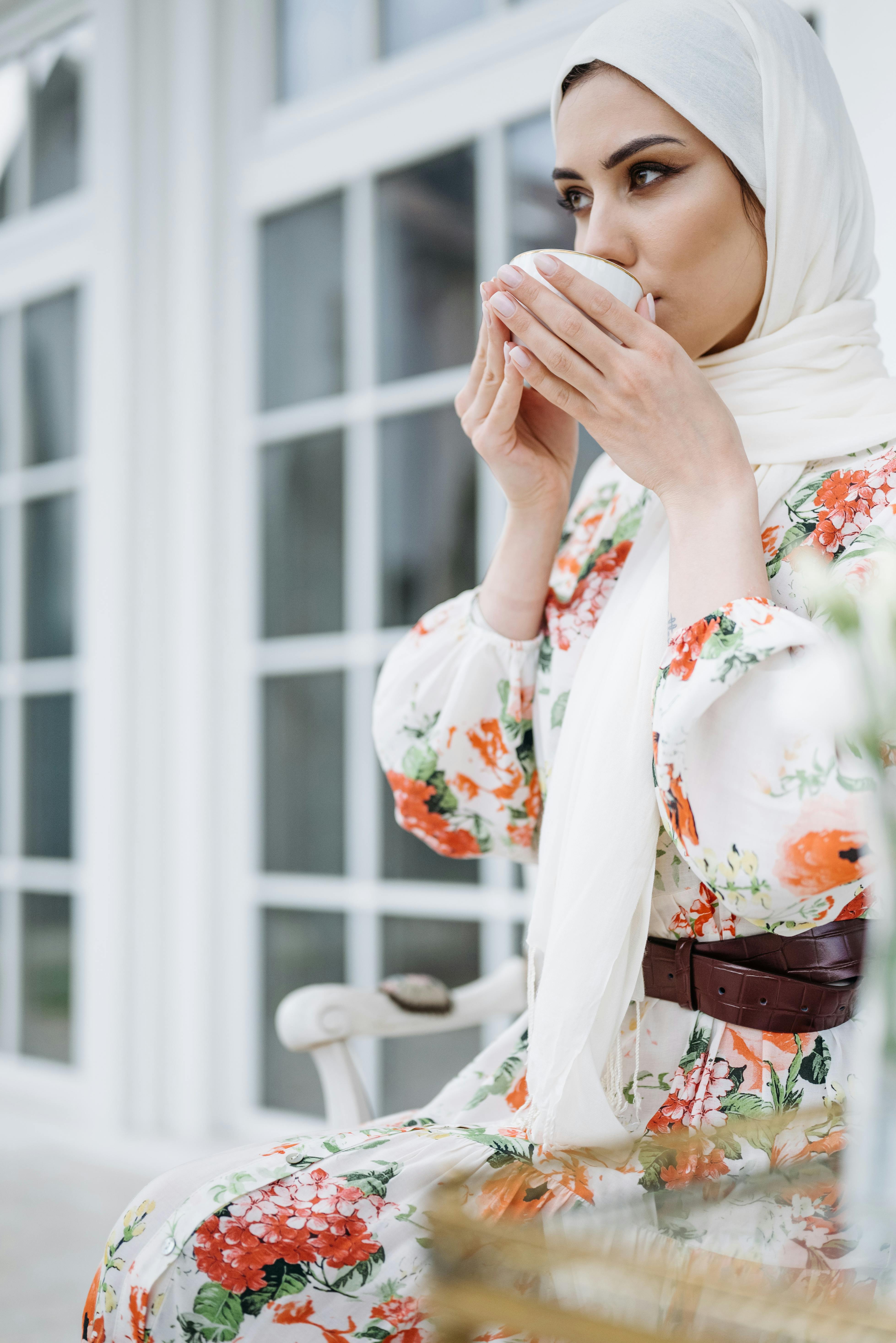 Women in Modesty Clothing Holding Coffee Cups · Free Stock Photo