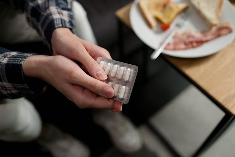 Person Holding Medicine