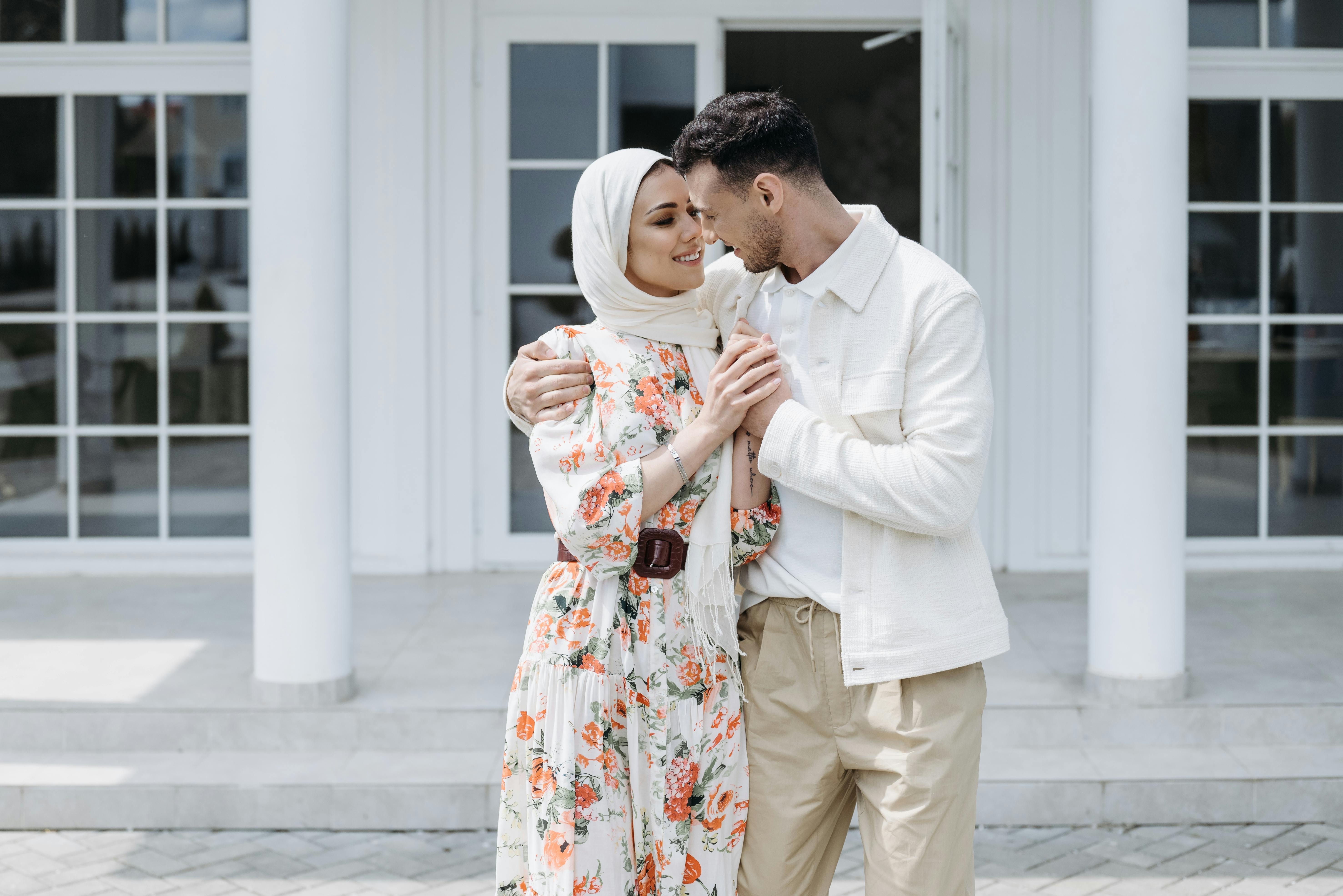 man in white jacket woman in white floral dress