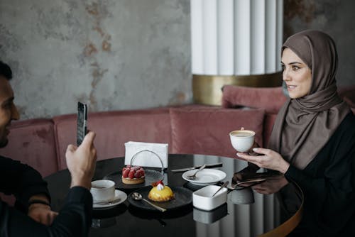 Free Woman Holding a Cup of Coffee Stock Photo