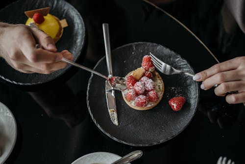 A Person Eating a Cake