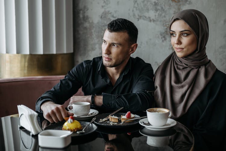 Man Sitting Beside A Woman