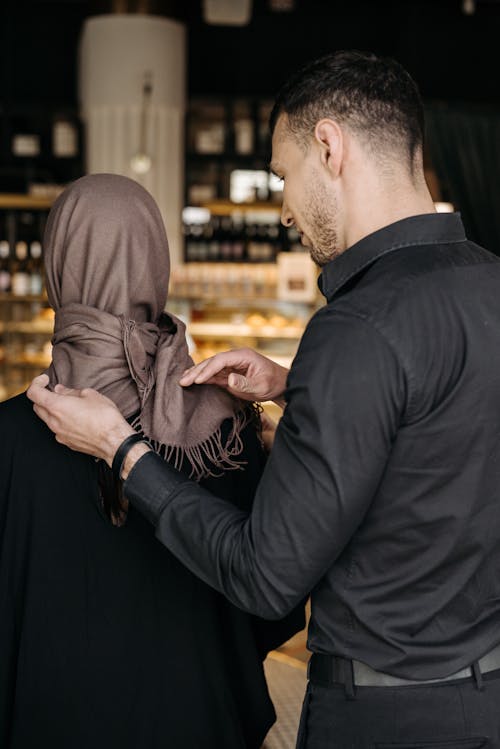 Elegant Man with Woman Wearing Headscarf