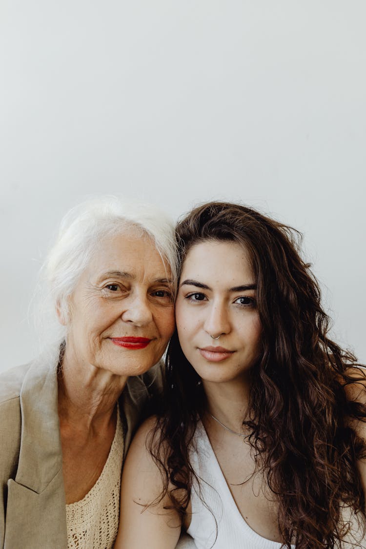 Women Smiling And Looking At The Camera