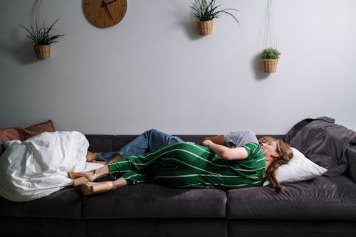 Free Couple Lying on the Couch Stock Photo