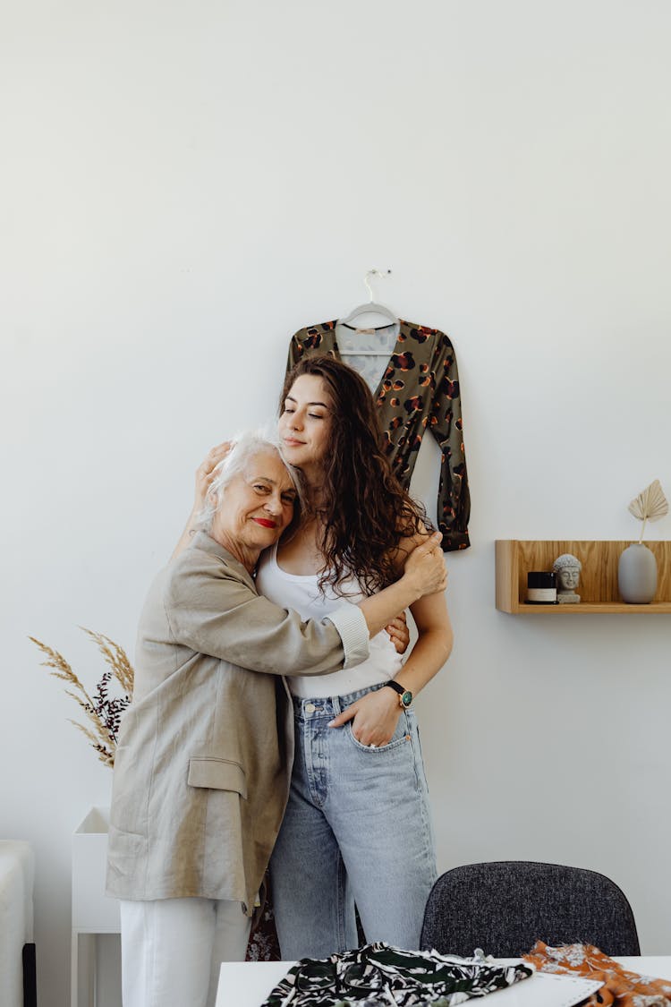 A Grandmother And Granddaughter Hugging Each Other