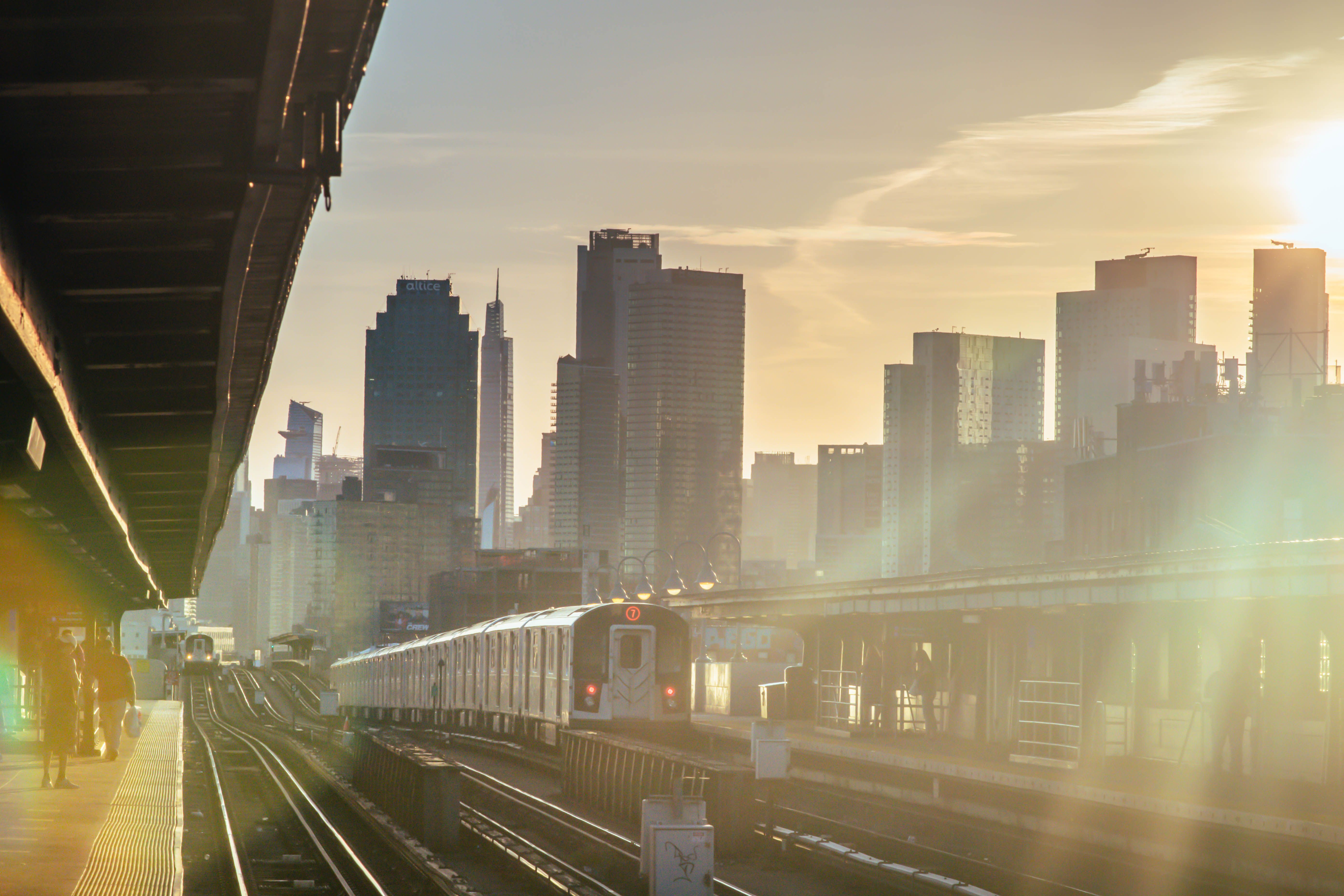Train platform with travelers and morning light