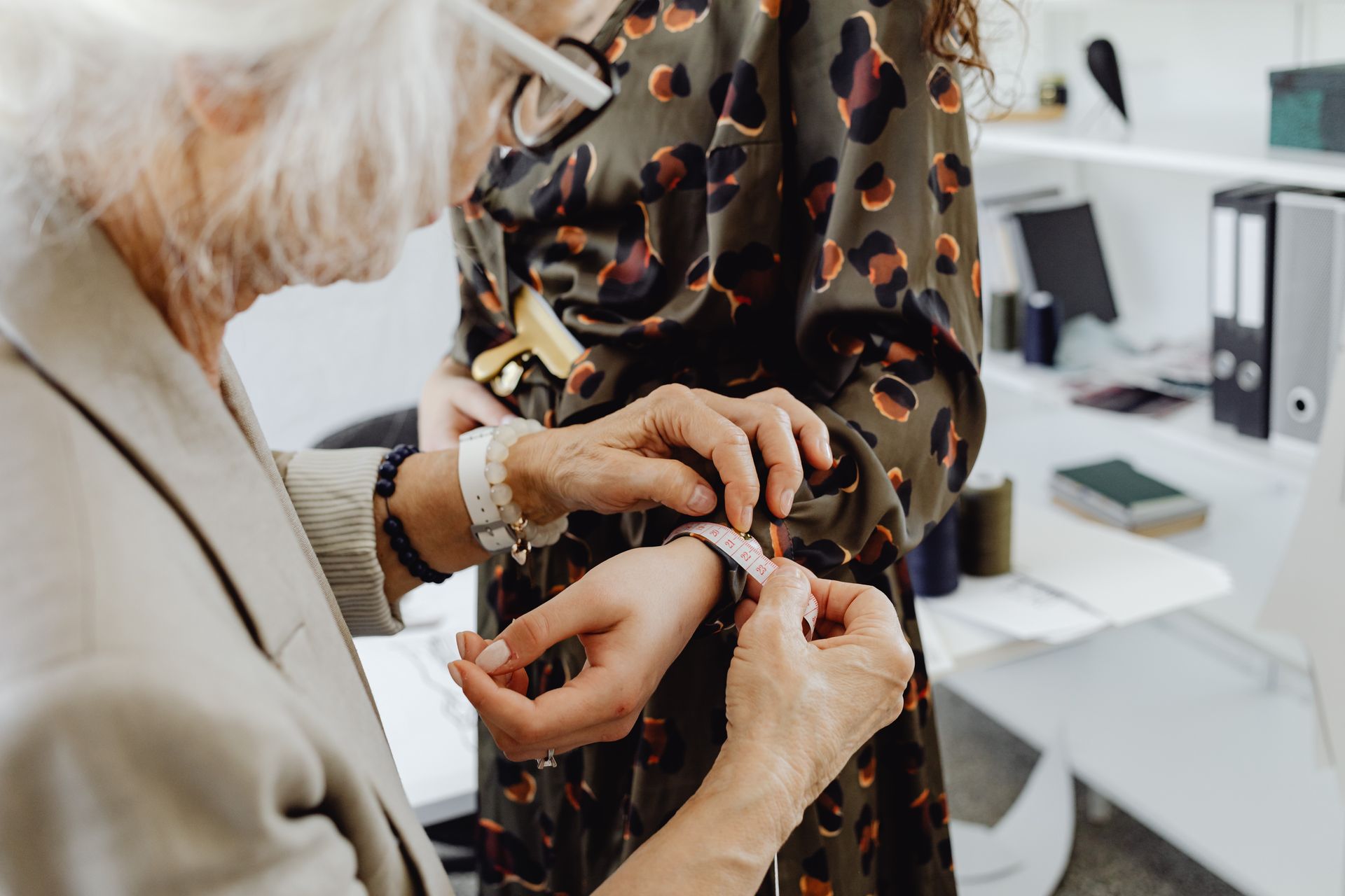 Gray Haired Woman Measure the Person's Wrist