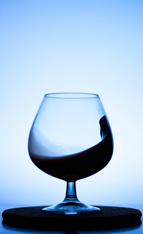 Free Clear Wine Glass with Black Liquid  Stock Photo