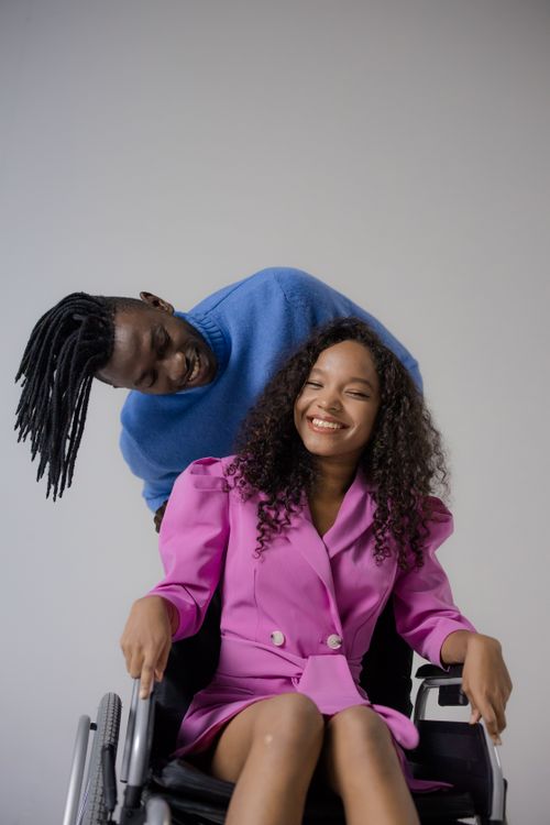 A Man Looking at a Woman on a Wheelchair · Free Stock Photo