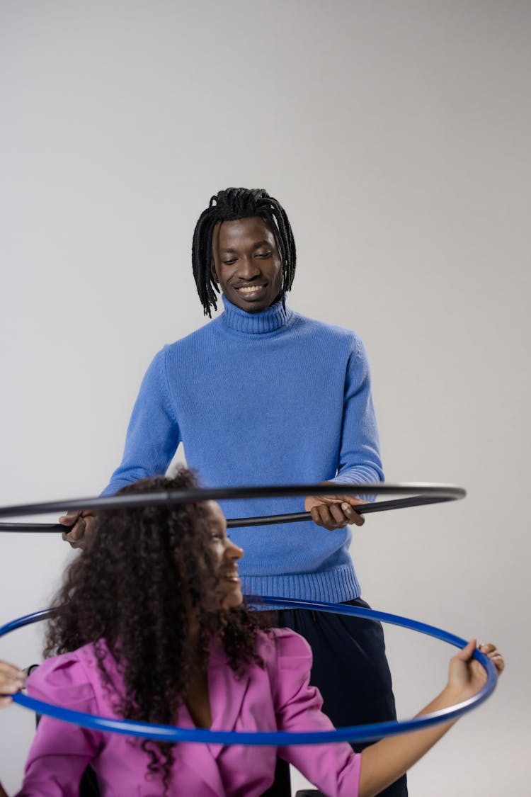 A Man And A Girl With Hula Hoops