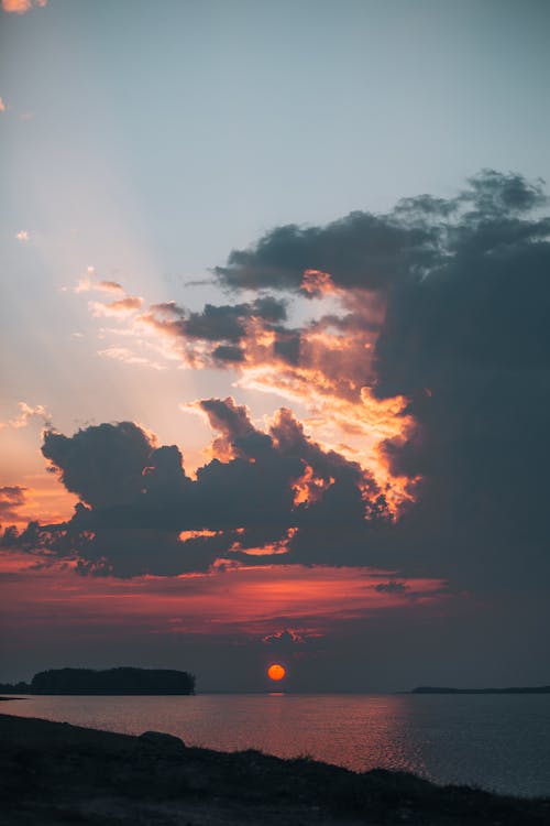 Foto profissional grátis de alvorecer, beira-mar, beleza