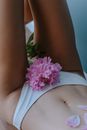 A Pink Flower and a Woman