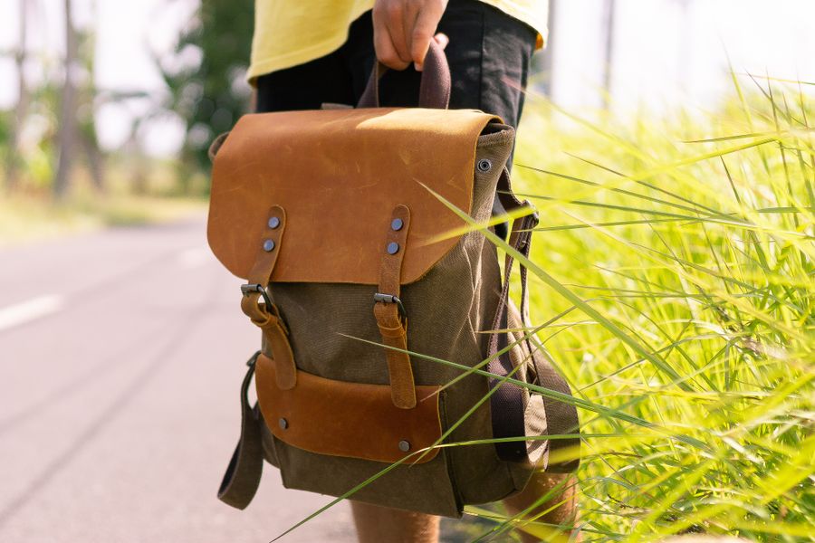 Waxed canvas satchel from the parts catalog — photo by ROMAN ODINTSOV on Pexels