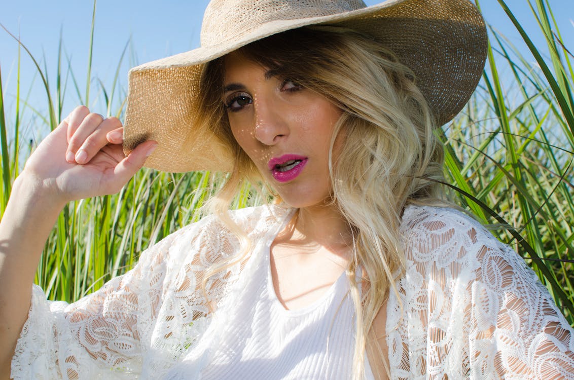 Blonde Hair Woman Wearing Brown Hat