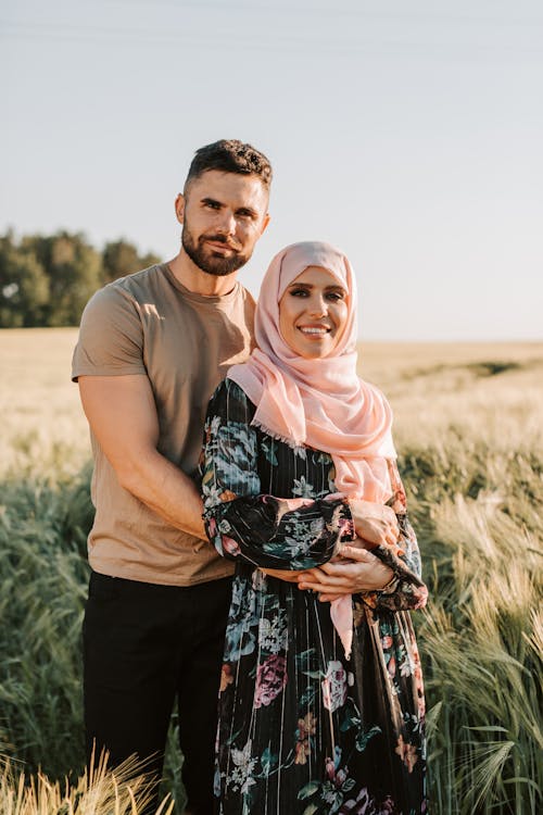 Free Couple Standing on Grass Field Stock Photo