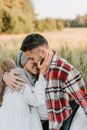 Happy Couple Staying on Grass Field
