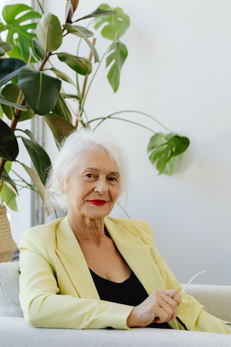 A Woman In Yellow Blazer Smiling