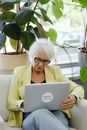 Woman in Yellow Blazer Using White Macbook