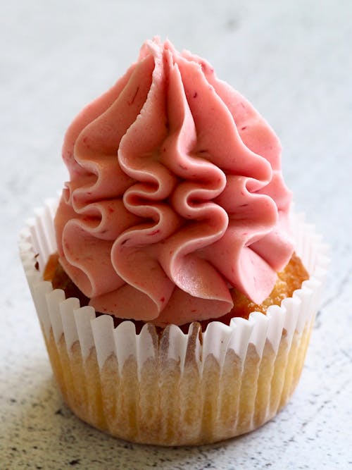 Free Cupcake With Pink Icing Stock Photo
