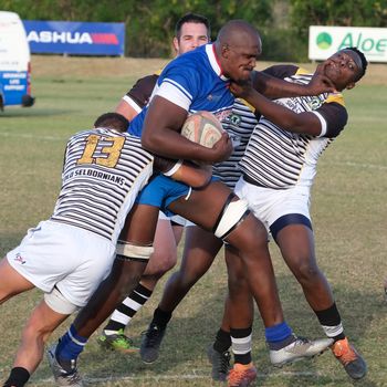 Rugby players engaged in a fierce tackle during a match in South Africa.（イメージ）