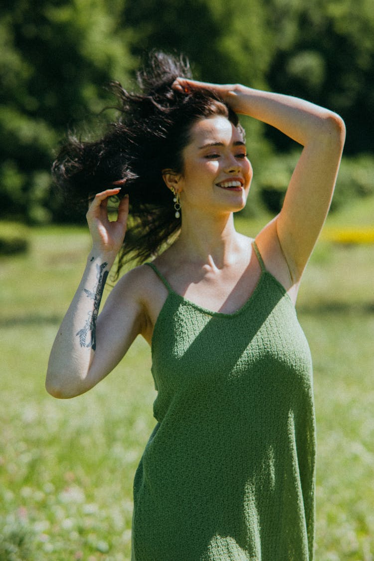 Woman In Green Dress Holding Her Hair