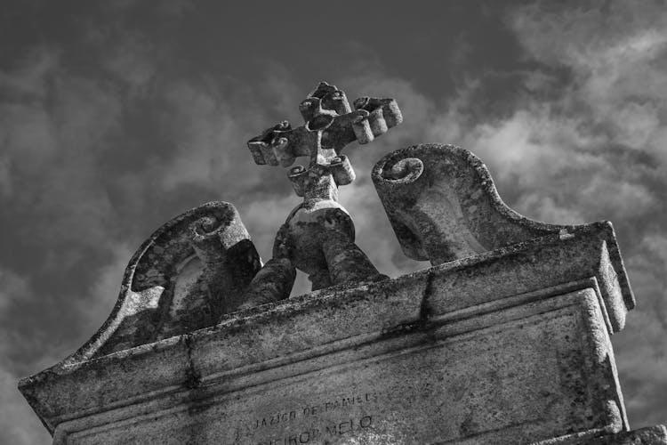 Grayscale Photo Of A Grave Marker