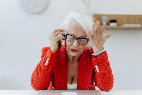 Free A Businesswoman Engaged in a Phone Call Stock Photo