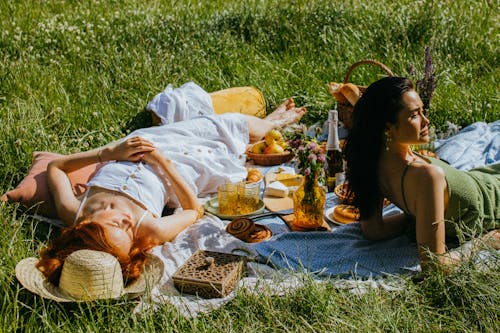 Women Lying Down Leisurely on the Picnic Blanket