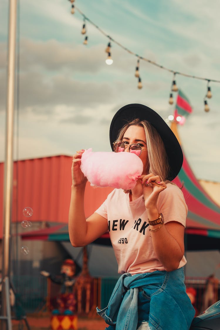 A Woman Eating Cotton Candy