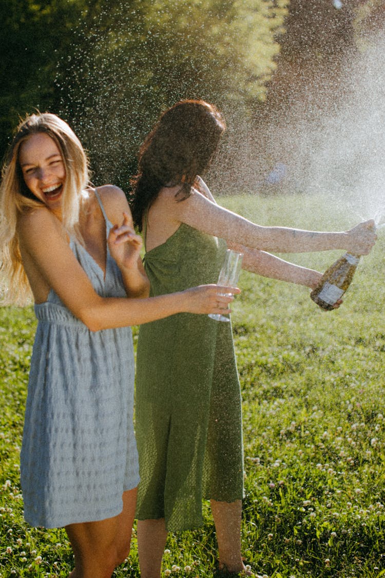 Happy Women Opening The Wine Bottle