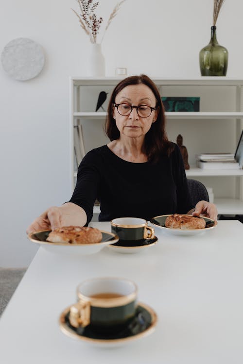 A Sad Woman in Black Top Sitting