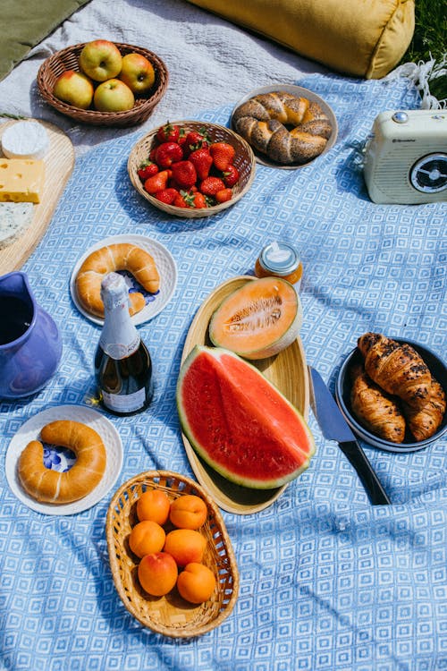 Free Mouthwatering Plates of Food on a Picnic Blanket Stock Photo