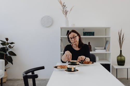 A Sad Woman in Black Top Sitting