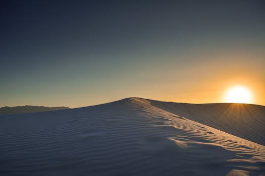 Capture the serene beauty of sunrise over the White Sands desert, NM.