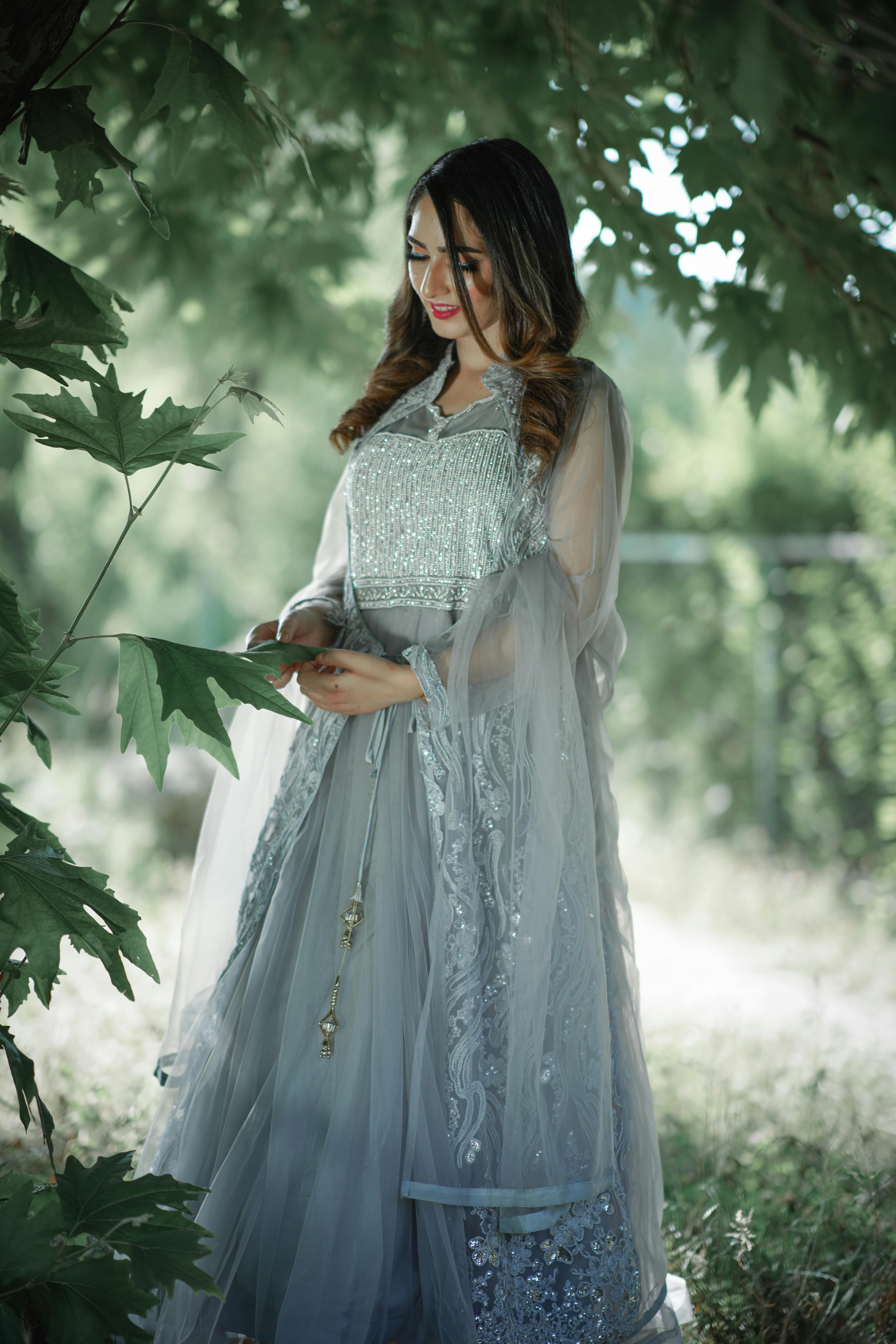 An Elegant Woman in Blue Dress Standing  Free Stock Photo