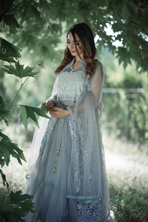 An Elegant Woman in Blue Dress Standing