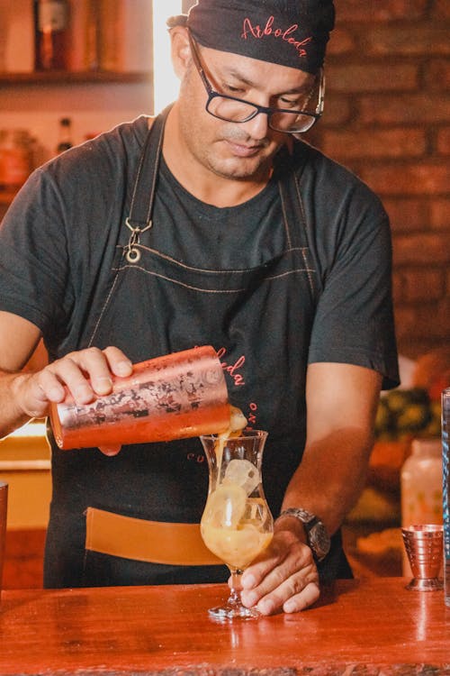 Man Preparing Cocktails in a Bar 