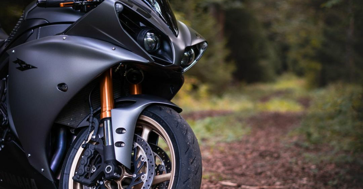 Motorcycle In Nature A Motorcycle in a Forest · Free Stock Photo