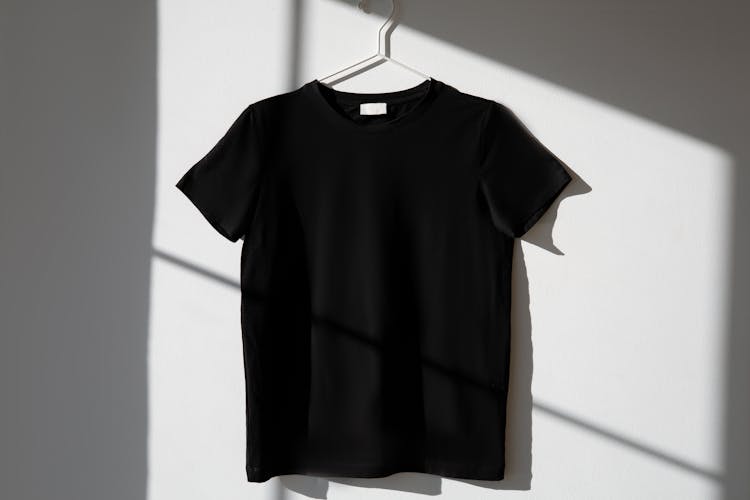 A Black Shirt Hanging On The Wall