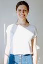 Smiling Woman in White Crew Neck T-shirt