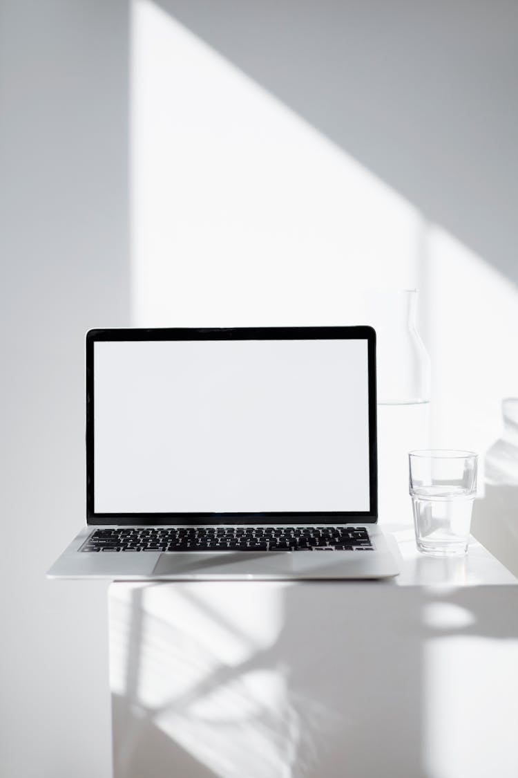 Macbook Mockup On White Table