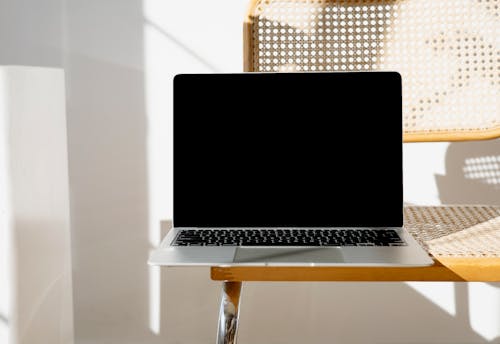 Free Photo of Macbook on Chair Stock Photo