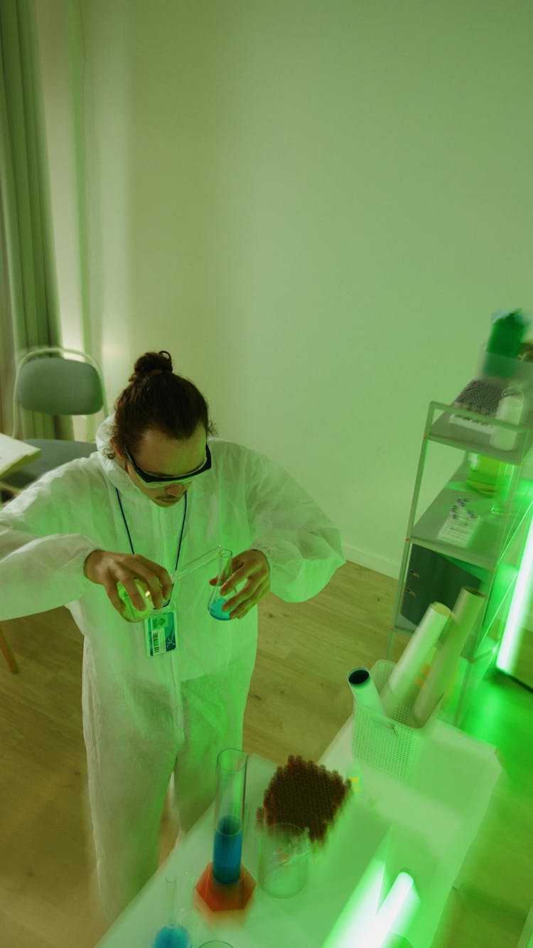 A Chemist Analyzing Chemicals On Test Tubes In A Laboratory