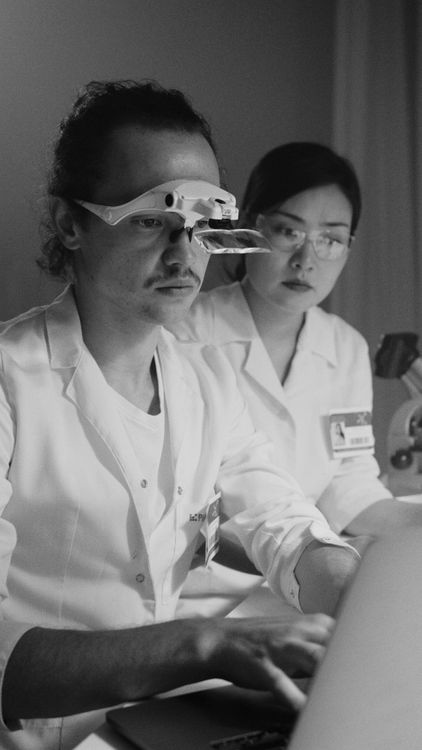 Grayscale Computer Lab Grayscale Photo of a Chemist Looking at Computer Laptop · Free Stock Photo