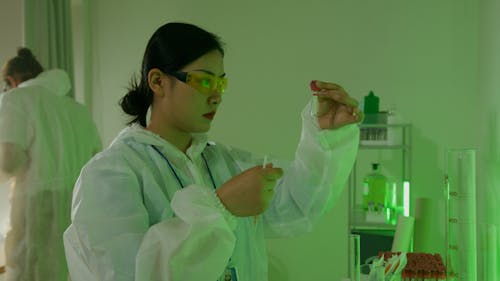 A Lab Assistant with a Test Tube