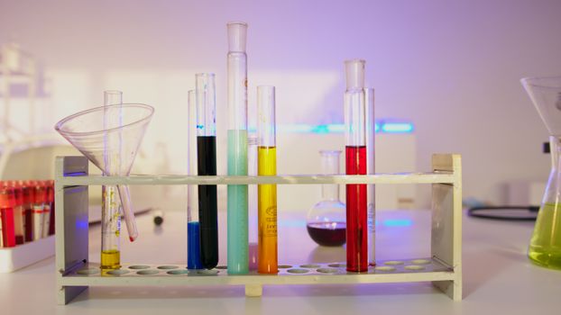 Vibrant test tubes filled with liquids in a modern lab setting, showcasing scientific exploration., free online jigsaw puzzle on JigsawPuzzlesFreeOnline.org