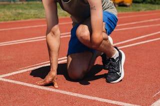 A Person Ready to Run on the Track