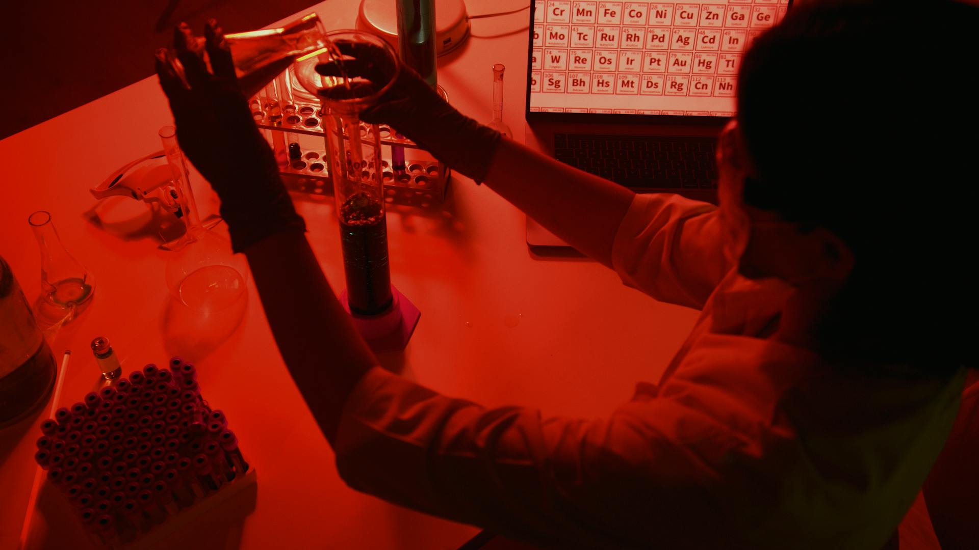 Scientist Working in Lab in Red Light