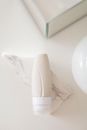 Minimalist skincare tube placed on marble, perfect for beauty and packaging themes.